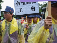 Protesters marching with banners and flags calling for more holidays, paid leave, more labour rights protections. During 2019 Labor Day Marc...