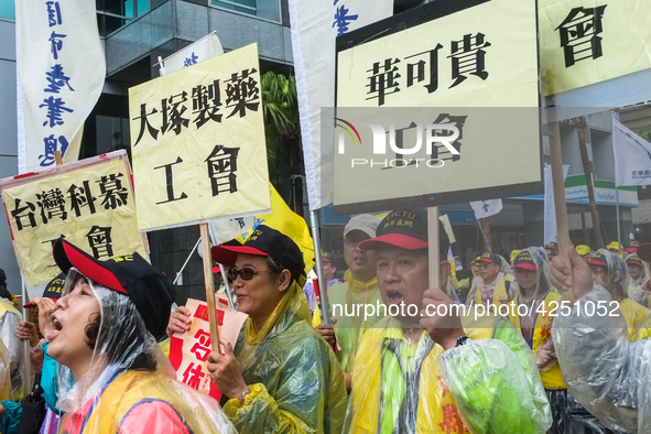 Protesters marching with banners calling for more holidays, paid leave, more labour rights protections. During 2019 Labor Day March 6,000 wo...