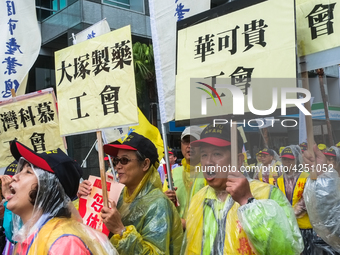 Protesters marching with banners calling for more holidays, paid leave, more labour rights protections. During 2019 Labor Day March 6,000 wo...