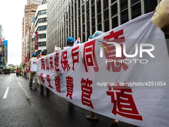 Banners calling for more holidays, paid leave, more labour rights protections. During 2019 Labor Day March 6,000 workers took the streets of...