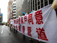 Banners calling for more holidays, paid leave, more labour rights protections. During 2019 Labor Day March 6,000 workers took the streets of...