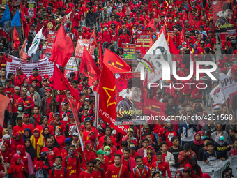 Indonesian workers take part in a May Day rally in Jakarta on May 1, 2019.  Thousands of Indonesian workers are urging the government to rai...