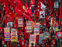 Indonesian workers take part in a May Day rally in Jakarta on May 1, 2019.  Thousands of Indonesian workers are urging the government to rai...