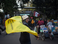 Indonesian worker pose during a May Day rally in Jakarta on May 1, 2019.  Thousands of Indonesian workers are urging the government to raise...