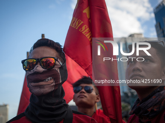 Indonesian workers listen to the oration during May Day rally in Jakarta on May 1, 2019.  Thousands of Indonesian workers are urging the gov...