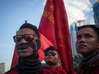 Indonesian workers listen to the oration during May Day rally in Jakarta on May 1, 2019.  Thousands of Indonesian workers are urging the gov...