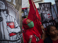 Indonesian worker listen to the oration during May Day rally in Jakarta on May 1, 2019.  Thousands of Indonesian workers are urging the gove...