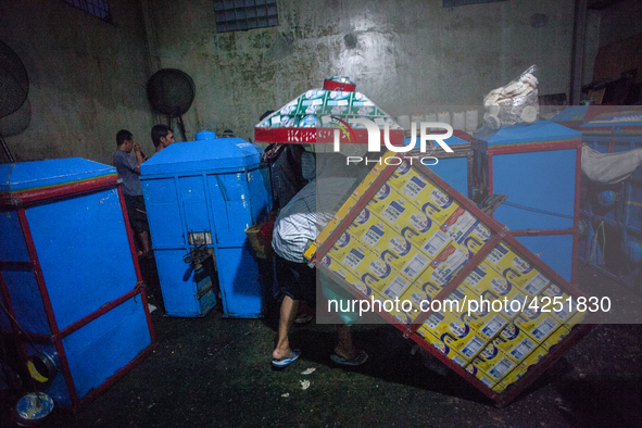 A man arranges dried kerupuk or crackers after they fry it at a kerupuk factory in Depok, Indonesia, 01 May 2019. Despite the government's d...