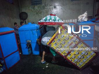 A man arranges dried kerupuk or crackers after they fry it at a kerupuk factory in Depok, Indonesia, 01 May 2019. Despite the government's d...