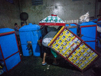 A man arranges dried kerupuk or crackers after they fry it at a kerupuk factory in Depok, Indonesia, 01 May 2019. Despite the government's d...