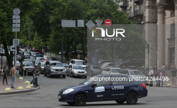 UBER taxi service vehicle drives through the Khreshchatyk street in Kyiv, Ukraine, May 7, 2019. New York Taxi Workers Alliance informs that...