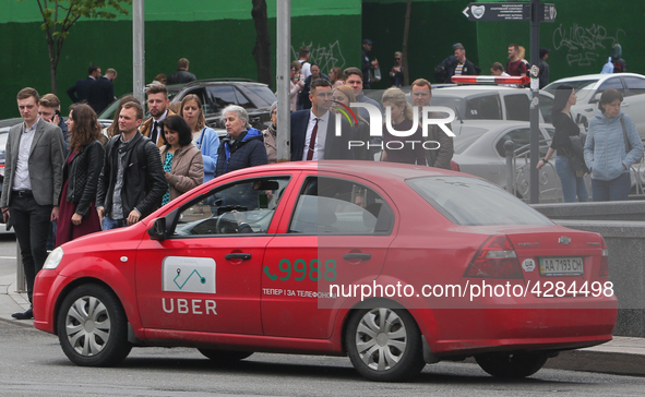 UBER taxi service vehicle drives through the Khreshchatyk street in Kyiv, Ukraine, May 7, 2019. New York Taxi Workers Alliance informs that...