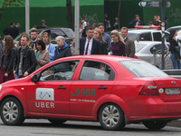 UBER taxi service vehicle drives through the Khreshchatyk street in Kyiv, Ukraine, May 7, 2019. New York Taxi Workers Alliance informs that...