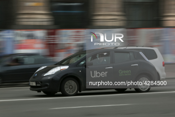 UBER taxi service vehicle drives through the Khreshchatyk street in Kyiv, Ukraine, May 7, 2019. New York Taxi Workers Alliance informs that...