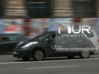 UBER taxi service vehicle drives through the Khreshchatyk street in Kyiv, Ukraine, May 7, 2019. New York Taxi Workers Alliance informs that...