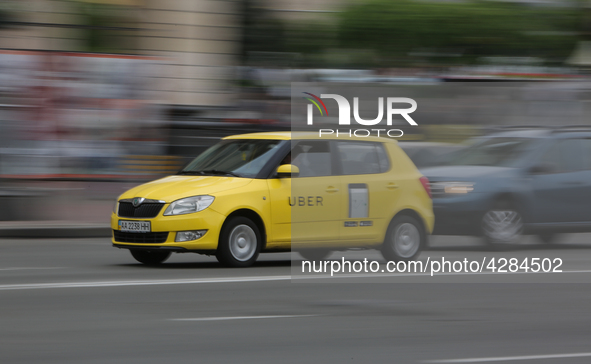 UBER taxi service vehicle drives through the Khreshchatyk street in Kyiv, Ukraine, May 7, 2019. New York Taxi Workers Alliance informs that...