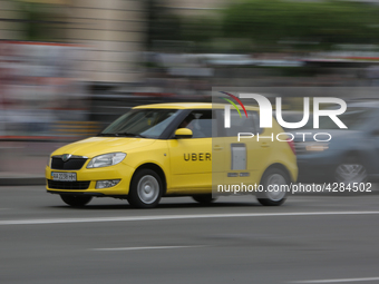 UBER taxi service vehicle drives through the Khreshchatyk street in Kyiv, Ukraine, May 7, 2019. New York Taxi Workers Alliance informs that...