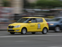 UBER taxi service vehicle drives through the Khreshchatyk street in Kyiv, Ukraine, May 7, 2019. New York Taxi Workers Alliance informs that...