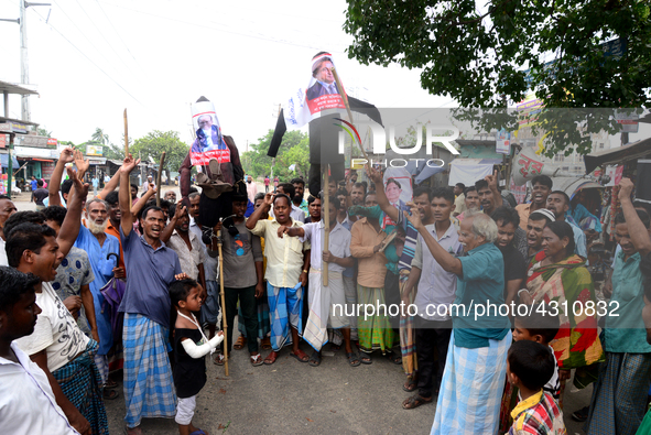 Bangladeshi Jute mill workers stage a road block demonstration to demanding arrears and fair wages at Demra in Dhaka, Bangladesh, on May 11,...