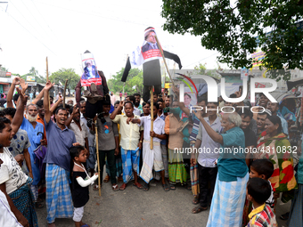 Bangladeshi Jute mill workers stage a road block demonstration to demanding arrears and fair wages at Demra in Dhaka, Bangladesh, on May 11,...