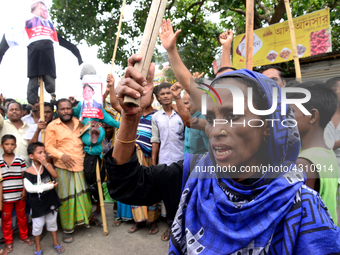 Bangladeshi Jute mill workers stage a road block demonstration to demanding arrears and fair wages at Demra in Dhaka, Bangladesh, on May 11,...