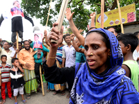 Bangladeshi Jute mill workers stage a road block demonstration to demanding arrears and fair wages at Demra in Dhaka, Bangladesh, on May 11,...