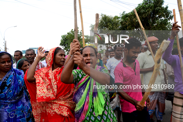 Bangladeshi Jute mill workers stage a road block demonstration to demanding arrears and fair wages at Demra in Dhaka, Bangladesh, on May 11,...