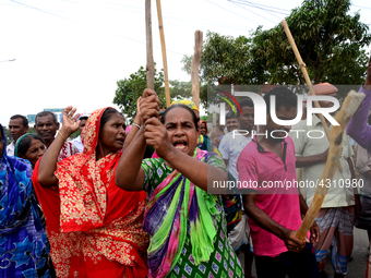 Bangladeshi Jute mill workers stage a road block demonstration to demanding arrears and fair wages at Demra in Dhaka, Bangladesh, on May 11,...