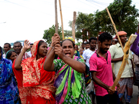 Bangladeshi Jute mill workers stage a road block demonstration to demanding arrears and fair wages at Demra in Dhaka, Bangladesh, on May 11,...