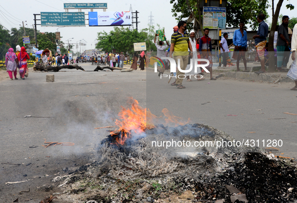 Bangladeshi Jute mill workers stage a road block demonstration to demanding arrears and fair wages at Demra in Dhaka, Bangladesh, on May 11,...