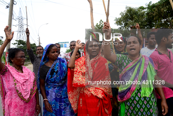 Bangladeshi Jute mill workers stage a road block demonstration to demanding arrears and fair wages at Demra in Dhaka, Bangladesh, on May 11,...