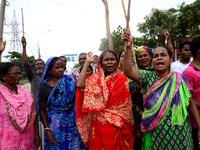 Bangladeshi Jute mill workers stage a road block demonstration to demanding arrears and fair wages at Demra in Dhaka, Bangladesh, on May 11,...