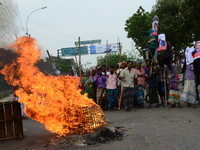 Bangladeshi Jute mill workers stage a road block demonstration to demanding arrears and fair wages at Demra in Dhaka, Bangladesh, on May 11,...