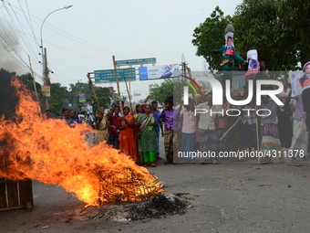 Bangladeshi Jute mill workers stage a road block demonstration to demanding arrears and fair wages at Demra in Dhaka, Bangladesh, on May 11,...