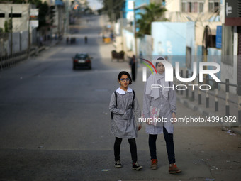 Palestinian students walk on their way to school to attend their end-of-year exams in Gaza City on May 23, 2019. (