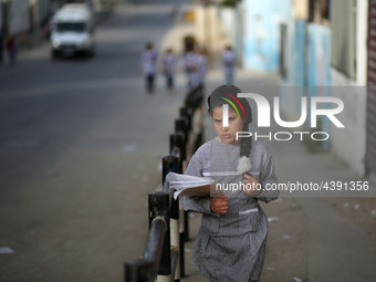 Palestinian students walk on their way to school to attend their end-of-year exams in Gaza City on May 23, 2019. (