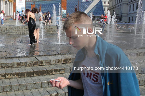 Ukrainian youth celebrates their graduation off the middle school 
with fooling in the fountains at Independence Square in Kyiv,  Ukraine,...