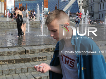 Ukrainian youth celebrates their graduation off the middle school 
with fooling in the fountains at Independence Square in Kyiv,  Ukraine,...