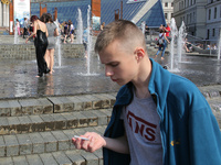 Ukrainian youth celebrates their graduation off the middle school 
with fooling in the fountains at Independence Square in Kyiv,  Ukraine,...