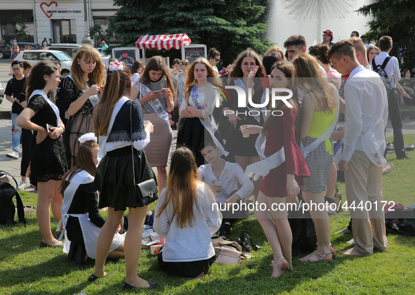 Ukrainian youth celebrates their graduation off the middle school 
with fooling in the fountains at Independence Square in Kyiv,  Ukraine,...