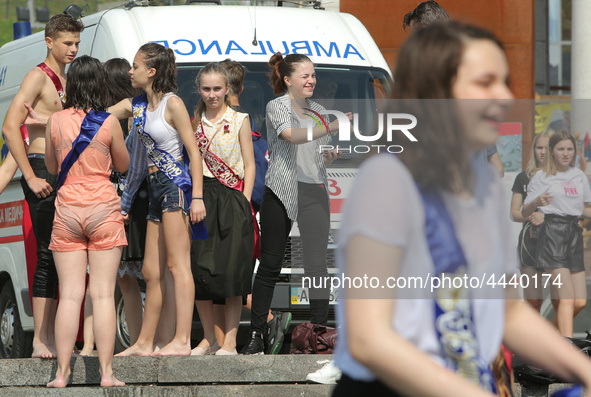 Ukrainian youth celebrates their graduation off the middle school 
with fooling in the fountains at Independence Square in Kyiv,  Ukraine,...