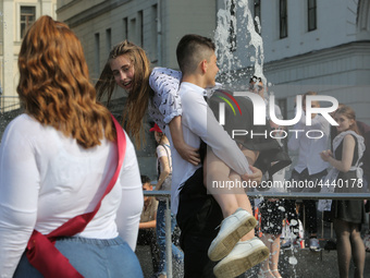 Ukrainian youth celebrates their graduation off the middle school 
with fooling in the fountains at Independence Square in Kyiv,  Ukraine,...