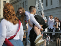 Ukrainian youth celebrates their graduation off the middle school 
with fooling in the fountains at Independence Square in Kyiv,  Ukraine,...