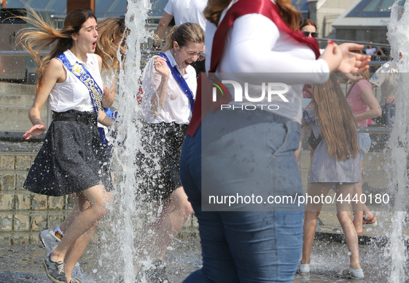 Ukrainian youth celebrates their graduation off the middle school 
with fooling in the fountains at Independence Square in Kyiv,  Ukraine,...