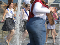 Ukrainian youth celebrates their graduation off the middle school 
with fooling in the fountains at Independence Square in Kyiv,  Ukraine,...