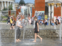 Ukrainian youth celebrates their graduation off the middle school 
with fooling in the fountains at Independence Square in Kyiv,  Ukraine,...