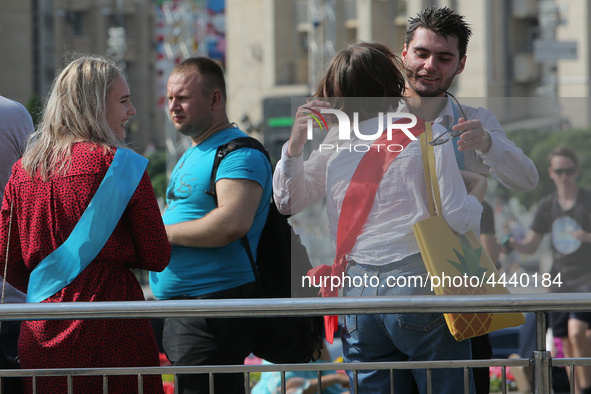 Ukrainian youth celebrates their graduation off the middle school 
with fooling in the fountains at Independence Square in Kyiv,  Ukraine,...