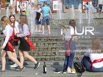 Ukrainian youth celebrates their graduation off the middle school 
with fooling in the fountains at Independence Square in Kyiv,  Ukraine,...