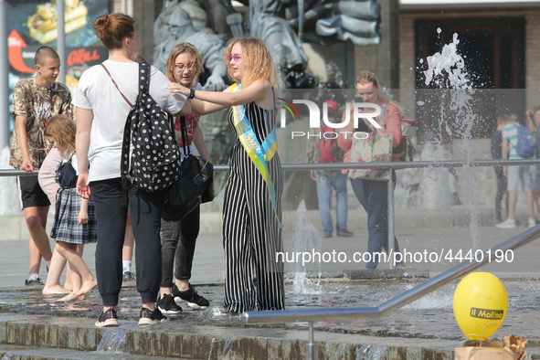 Ukrainian youth celebrates their graduation off the middle school 
with fooling in the fountains at Independence Square in Kyiv,  Ukraine,...