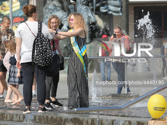 Ukrainian youth celebrates their graduation off the middle school 
with fooling in the fountains at Independence Square in Kyiv,  Ukraine,...